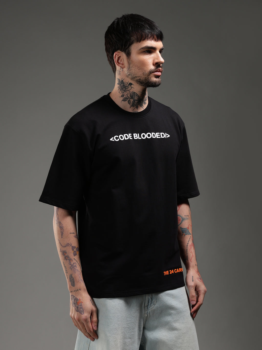 Model wearing black Code Blooded t-shirt front developer streetwear outfit
