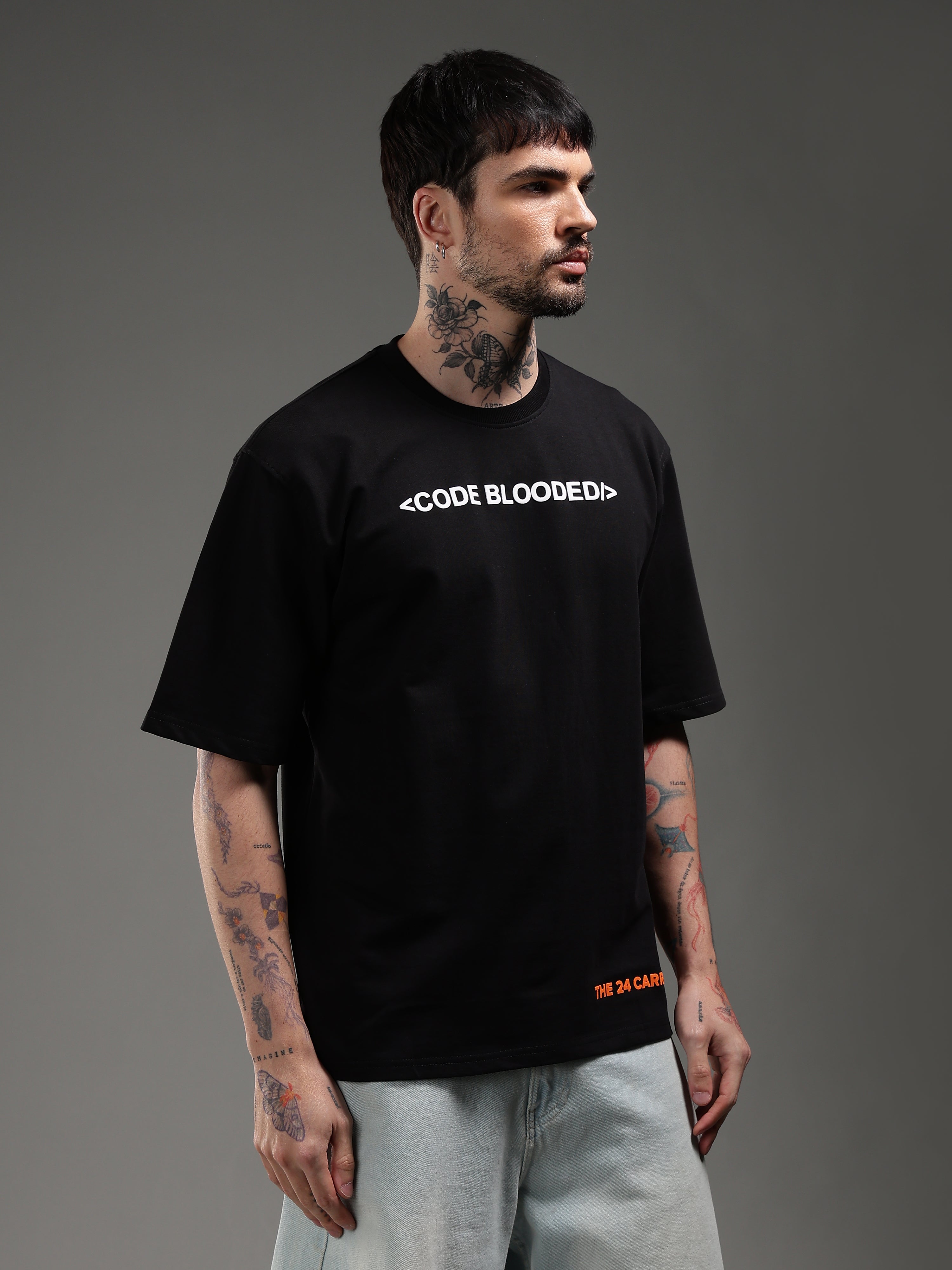 Model wearing black Code Blooded t-shirt front developer streetwear outfit