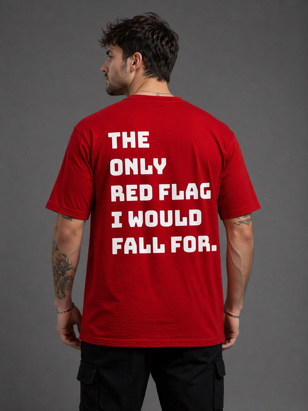 Man wearing red RCB oversized t-shirt back view