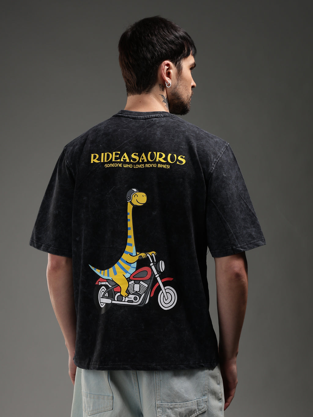 Model wearing Rideasaurus biker t-shirt back streetwear outfit